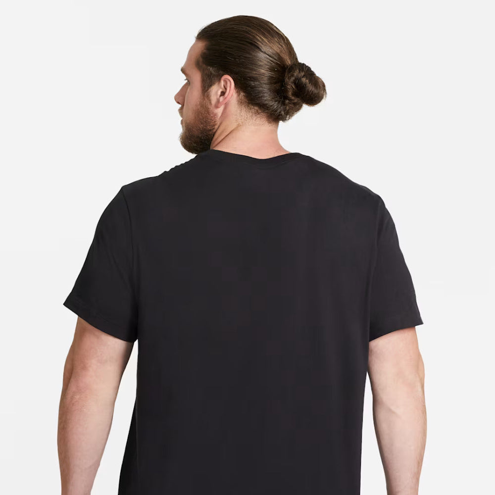 Person wearing a black t-shirt on a white background