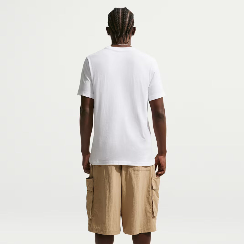 Person wearing a white t-shirt and beige cargo shorts on a white background